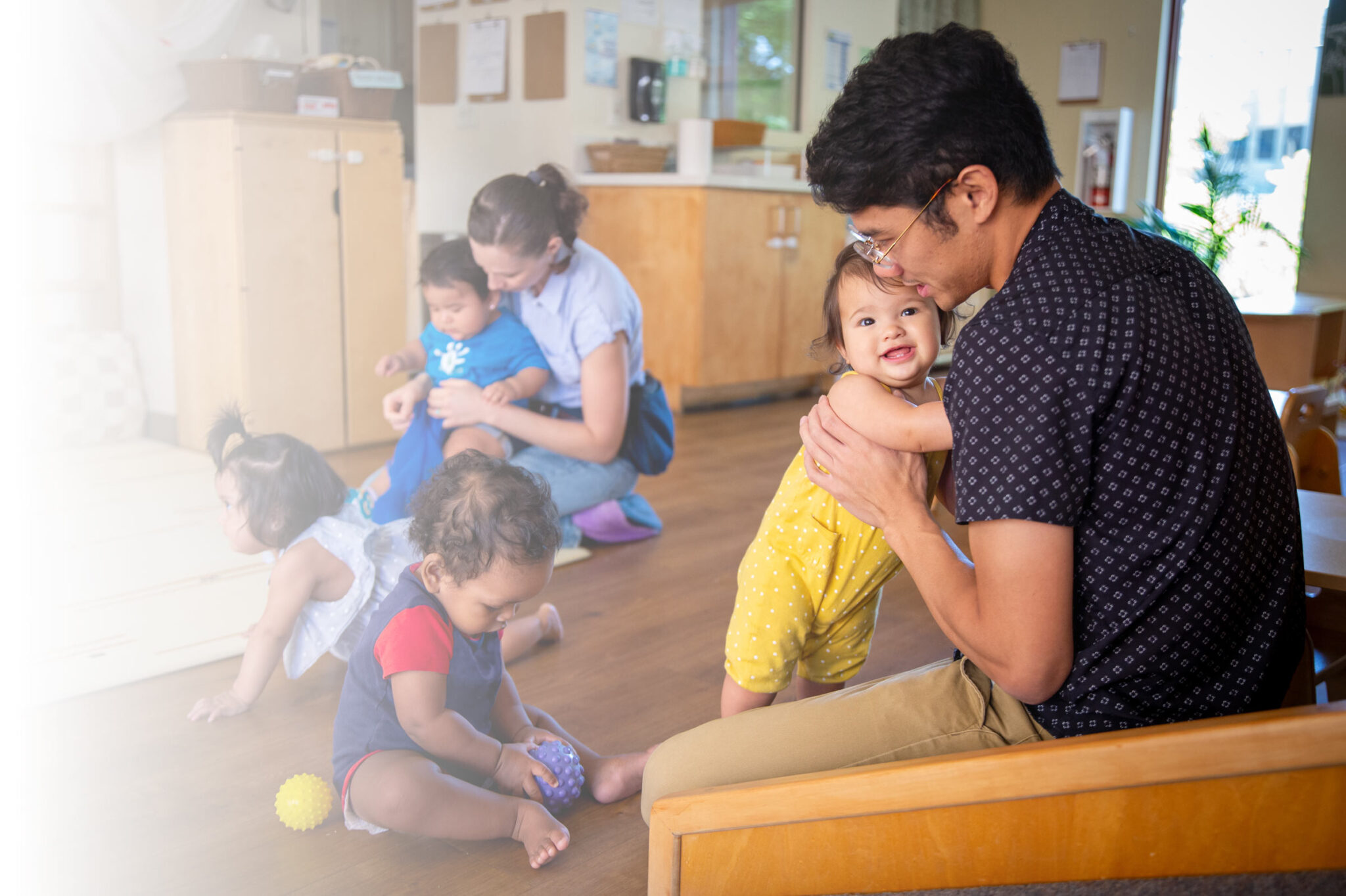 Adults and toddlers playing